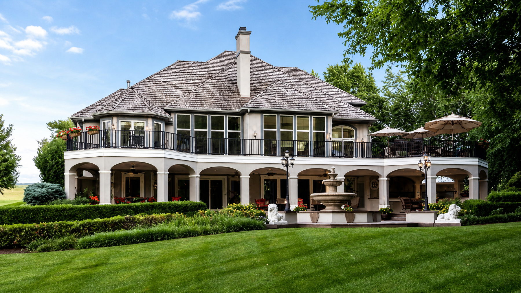 Luxury Kansas City estate with outdoor living and patio in daylight - MoJo Real Estate Team