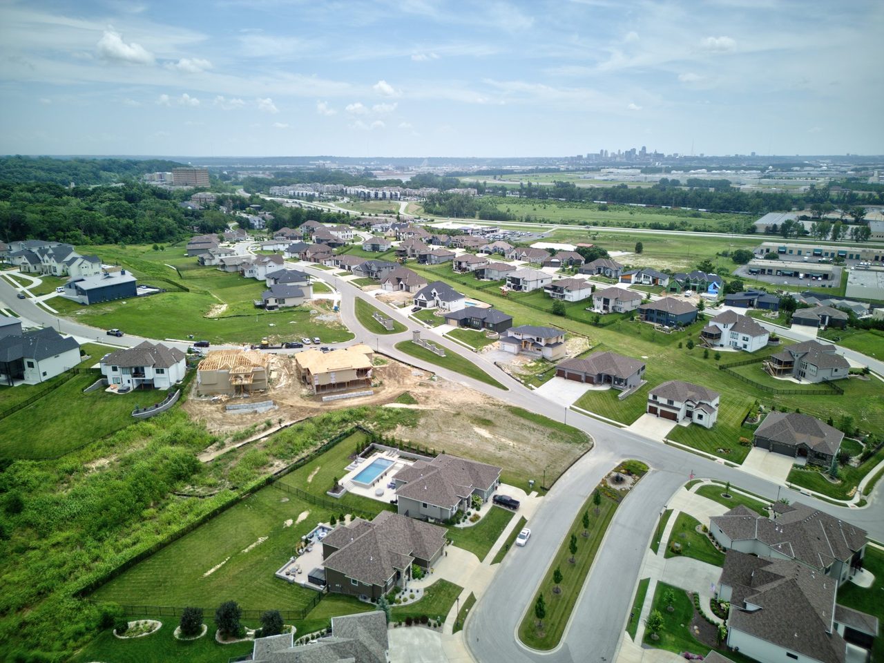 Aerial view of The Palisades in Riverside, Missouri with the Kansas City skyline in the distance
